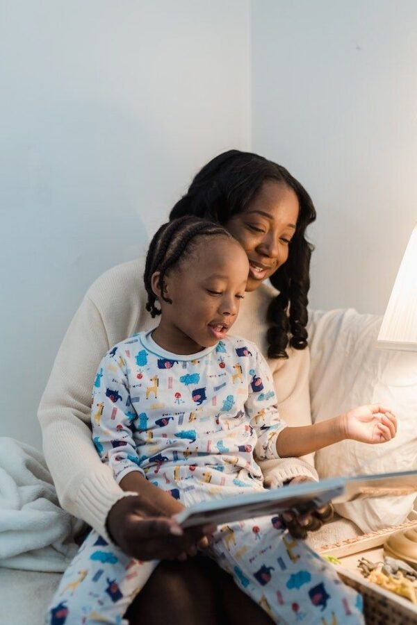 Bitney Adventures - African American Mother Reading to Child - Pexels