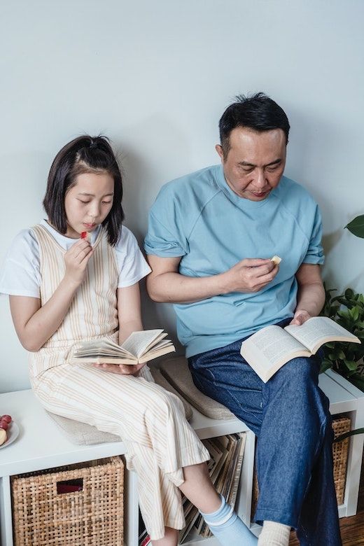 Bitney Adventures - Father and Daughter Reading - Pexels