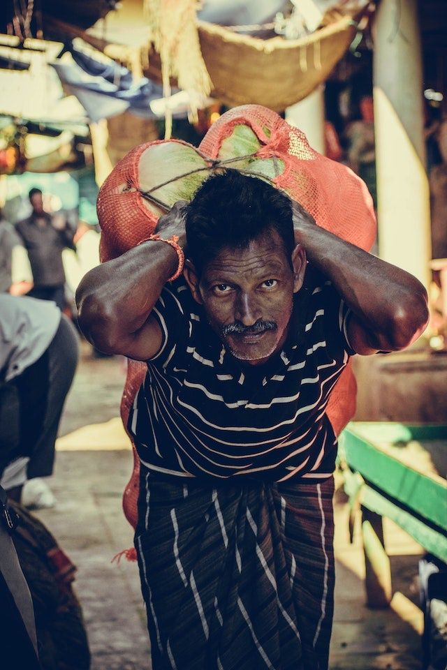 The Children's Newsletter by Bitney - Brown Man Carrying Watermelons - Pexels