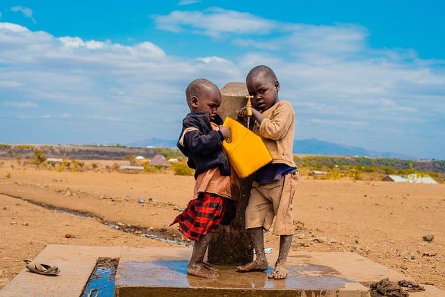 The Children's Newsletter by Bitney - African Children Gathering Water Outside - Pixabay