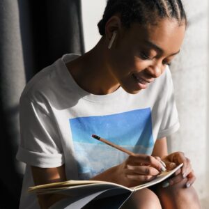 Bitney Adventures - Holy Spirit Music – End of a Tragedy T-Shirt - Without Text - Woman Writing Wearing T-Shirt - White Bitney Adventures - Holy Spirit Music – End of a Tragedy T-Shirt - Without Text - Woman Writing Wearing T-Shirt - White